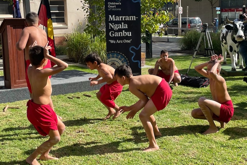 Six indigenous children performing.