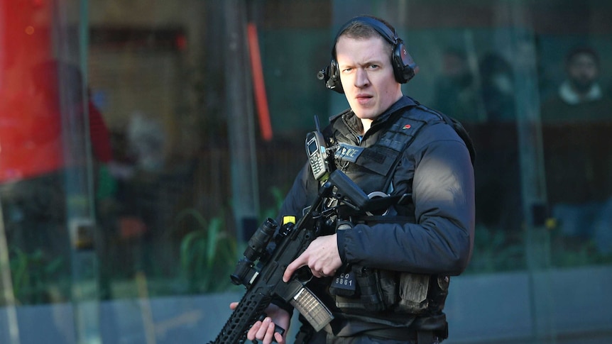 An armed police officer outside Borough Market after an incident on London Bridge.
