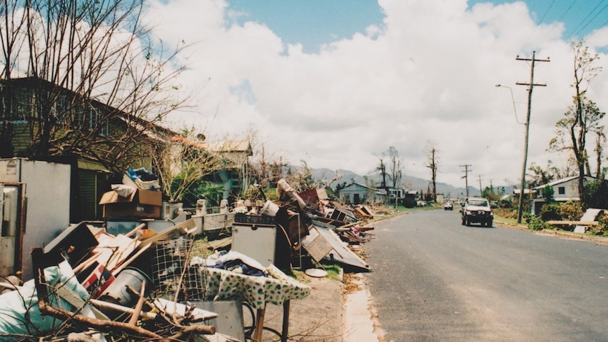 Rubbish lines a street in the wake of Cyclone Yasi