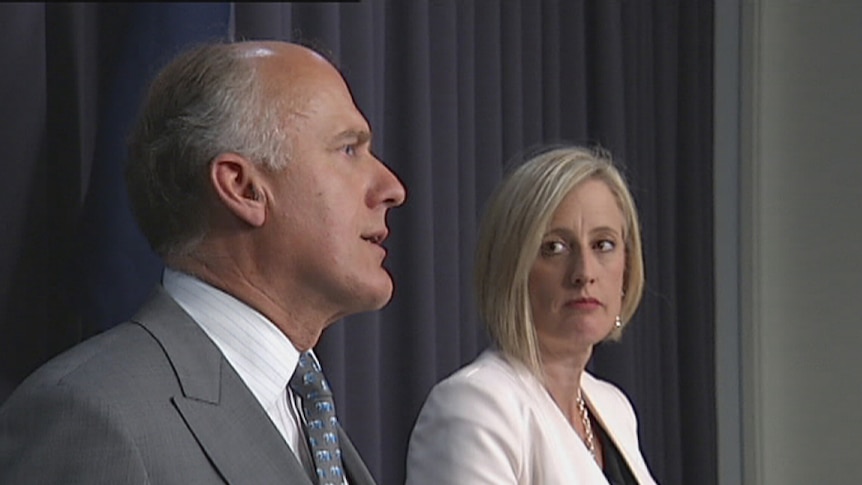 Chief Minister Katy Gallagher watches as Senator Eric Abetz explains the loan deal.