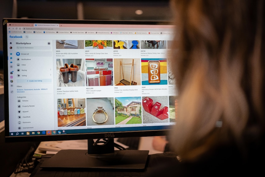 a woman looking at facebook marketplace on a computer