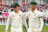 Michael Clarke and Chris Rogers take to the field