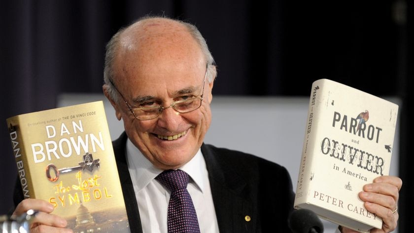 Professor Alan Fels displays books during a Press Club speech