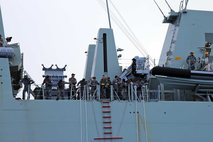 Navy officers on board HMAS Brisbane.