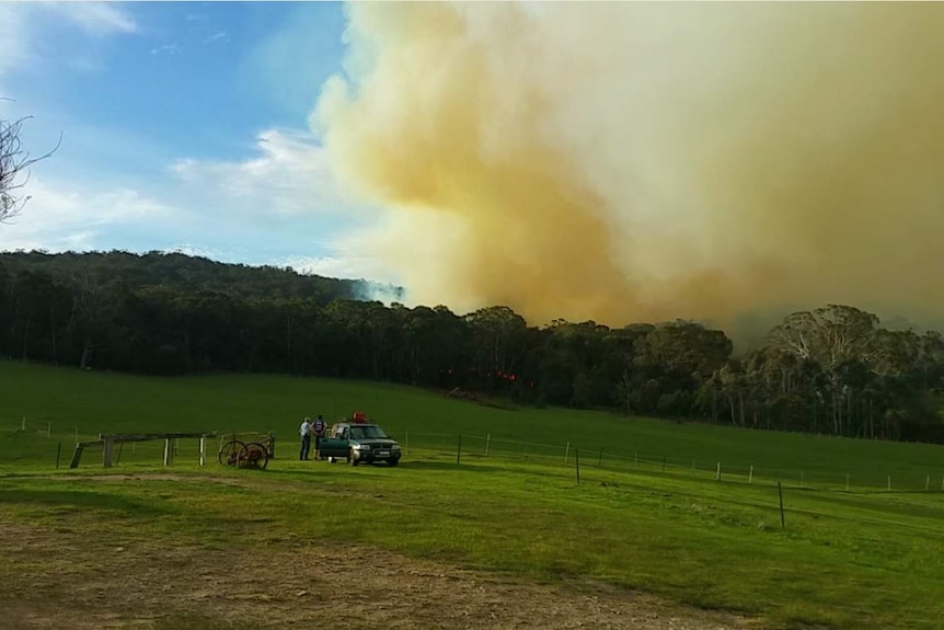 A blaze that broke containment lines comes within striking distance of a home near Lancefield
