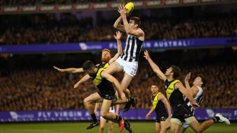 Mason Cox of the Magpies (3L) marks during the second quarter against Richmond.