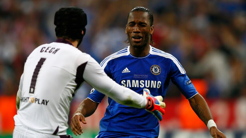 Didier Drogba (R) celebrates after scoring the winning penalty in the Champions League final against Bayern Munich.