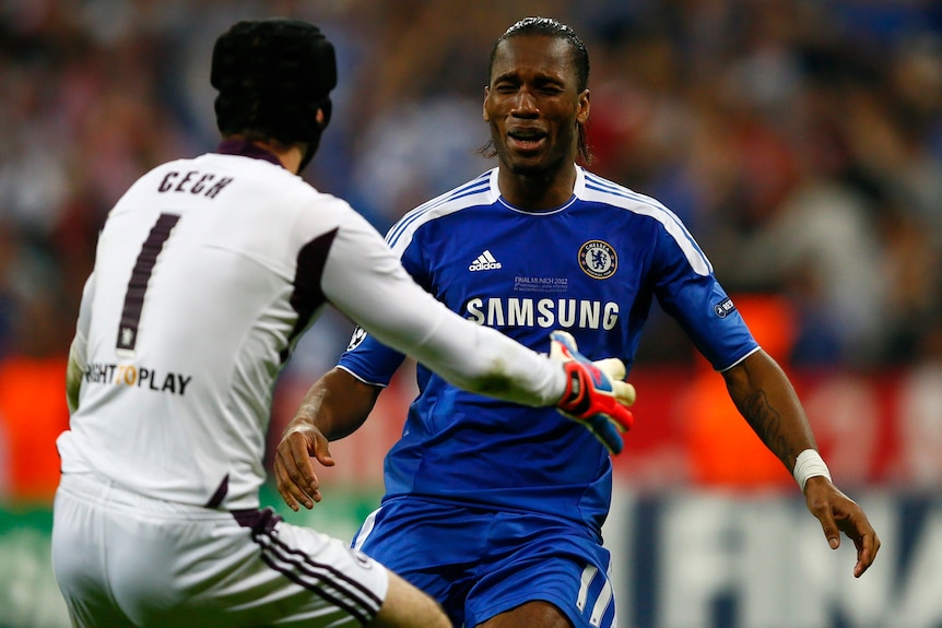 Didier Drogba (R) celebrates after scoring the winning penalty in the Champions League final against Bayern Munich.