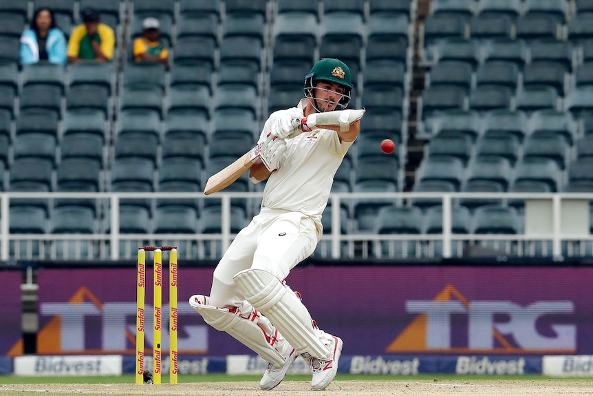 Australia's batsman Pat Cummins avoids a bouncer