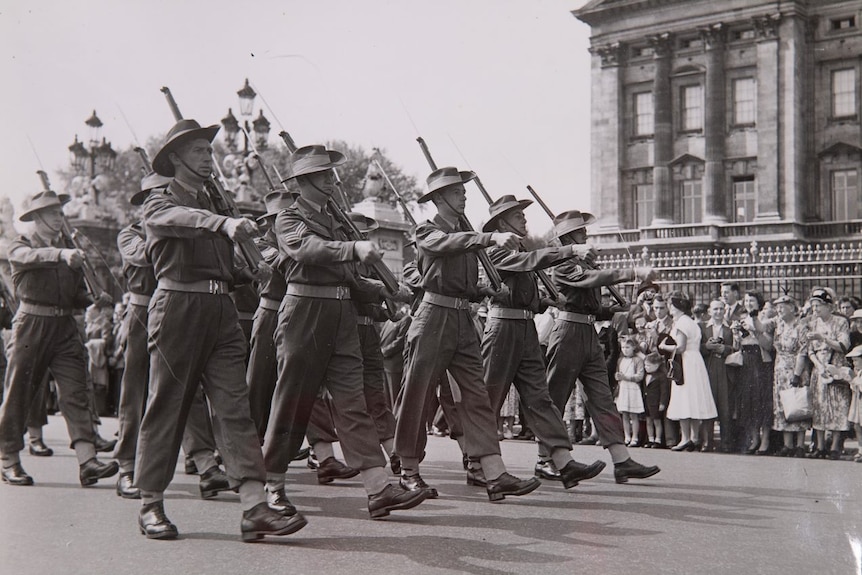 Soldiers march through London for Queen Elizabeth II's coronation.