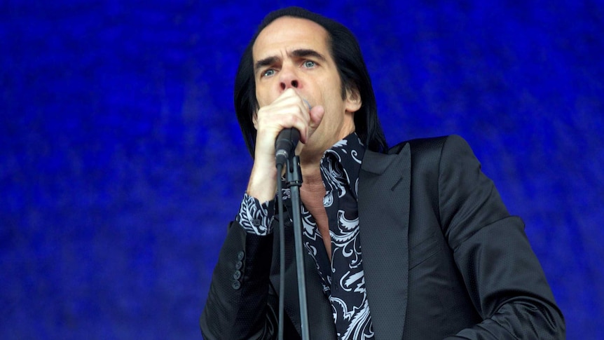 Nick Cave and the Bad Seeds on stage at Glastonbury.