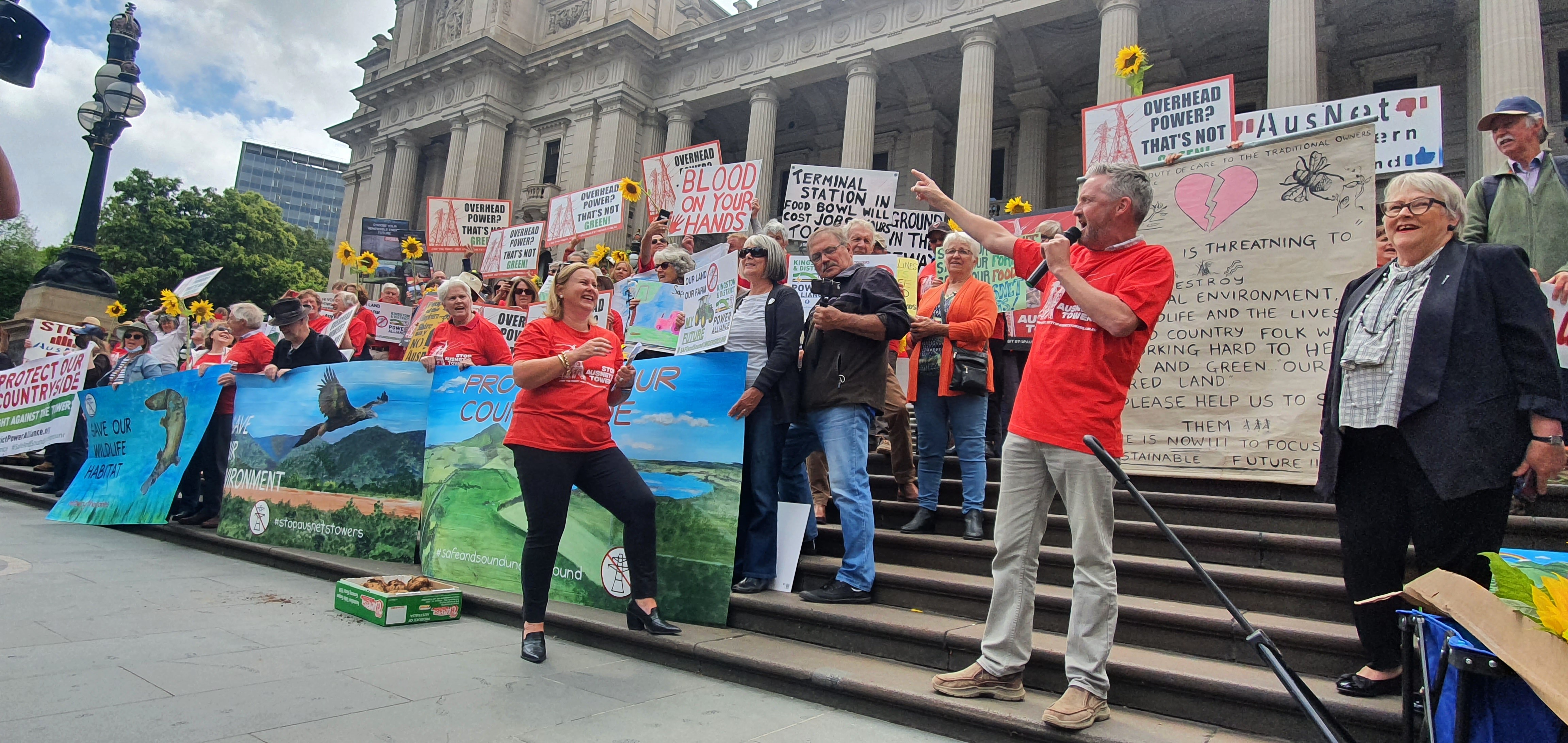 People speaking at a protest.