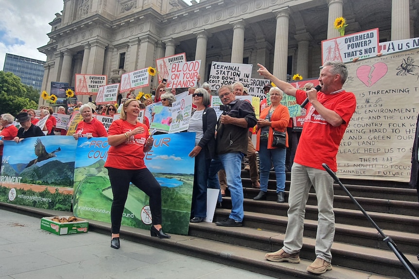 People speaking at a protest.