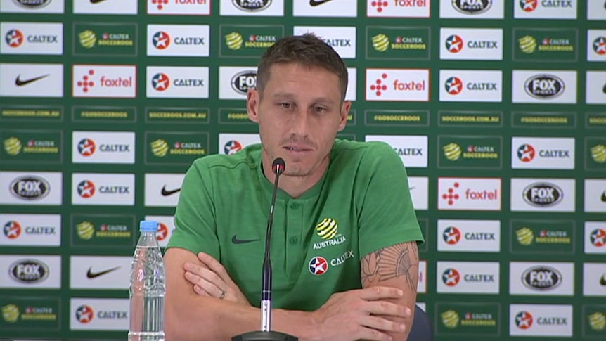 Mark Milligan urges fans to lay off Robbie Kruse
