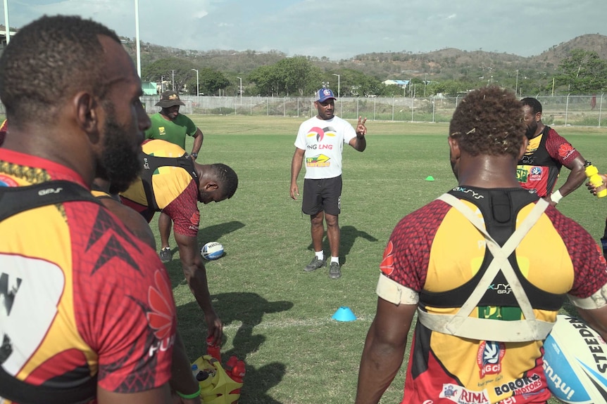PNG Hunters coach Michael Marum addresses his players.