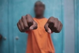 Fists in focus of a young offender at Don Dale Detention Centre