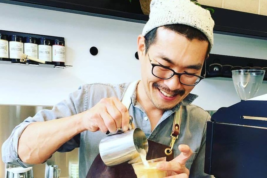 Mr Shin working in a cafe.