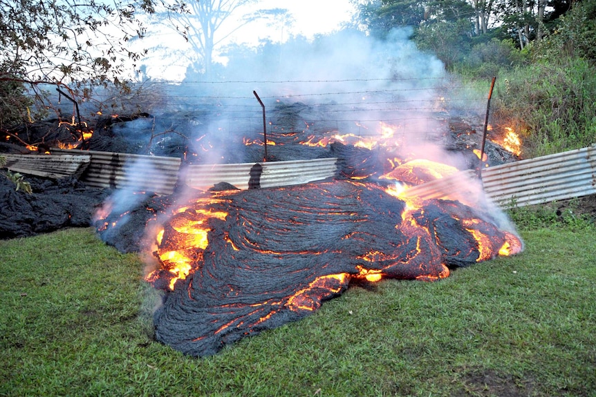 Lava crawls across property