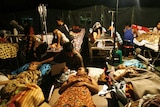 Patients rest in a makeshift Padang hospital