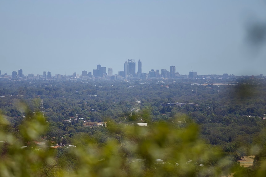 A hazy sky envelops Perth's metro area from a high vantage point