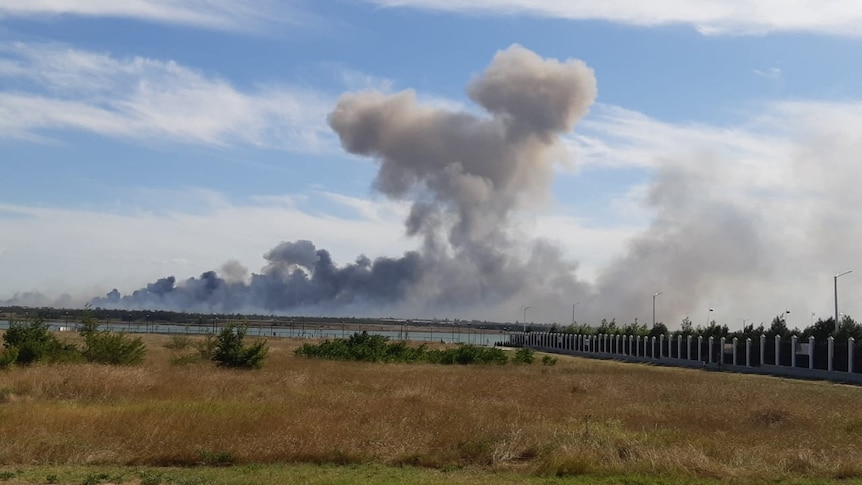 Smoke rises after explosions from the Saky air base near Novofedorivka on Crimea's western coast.