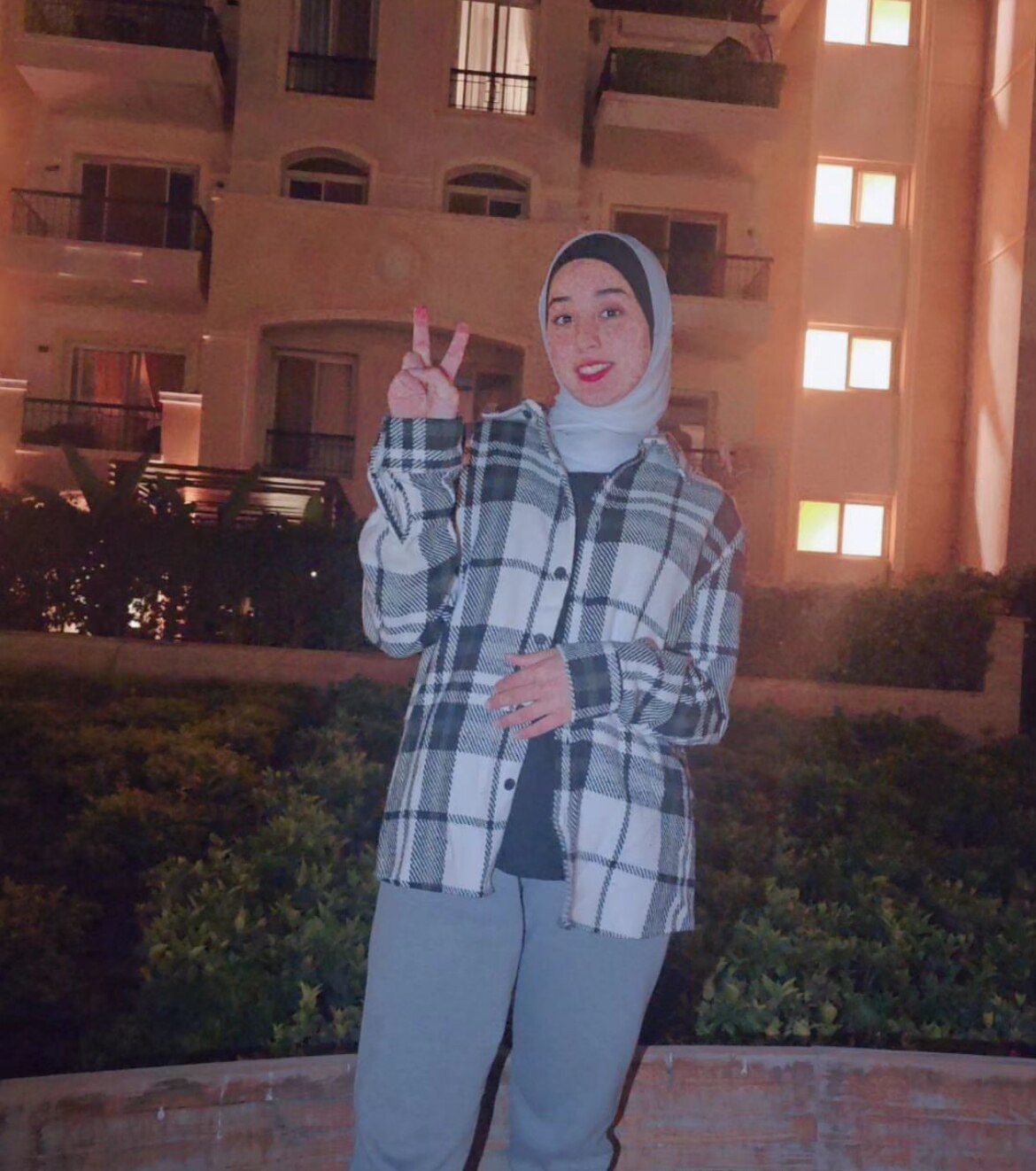 Juamana holding up a peace sign in Egypt. 