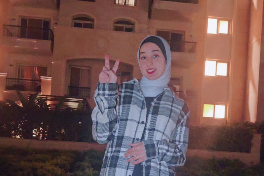 Juamana holding up a peace sign in Egypt. 