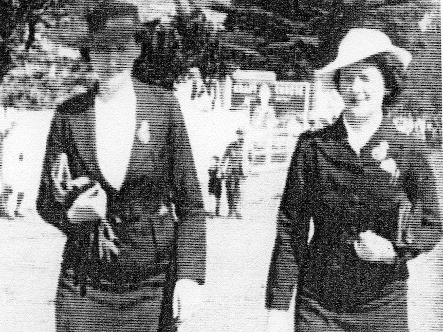 A grainy black and white picture from the 194os showing two female police officers in plain clothes.
