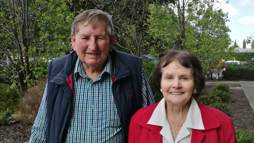 Reginald George Heading standing with his wife,