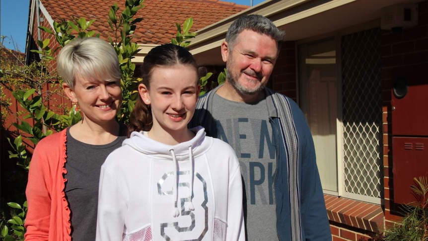 Geoff, Felicity and Estella Glenncross outside their Nollamara home.