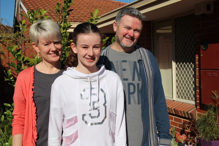 Geoff, Felicity and Estella Glenncross outside their Nollamara home.