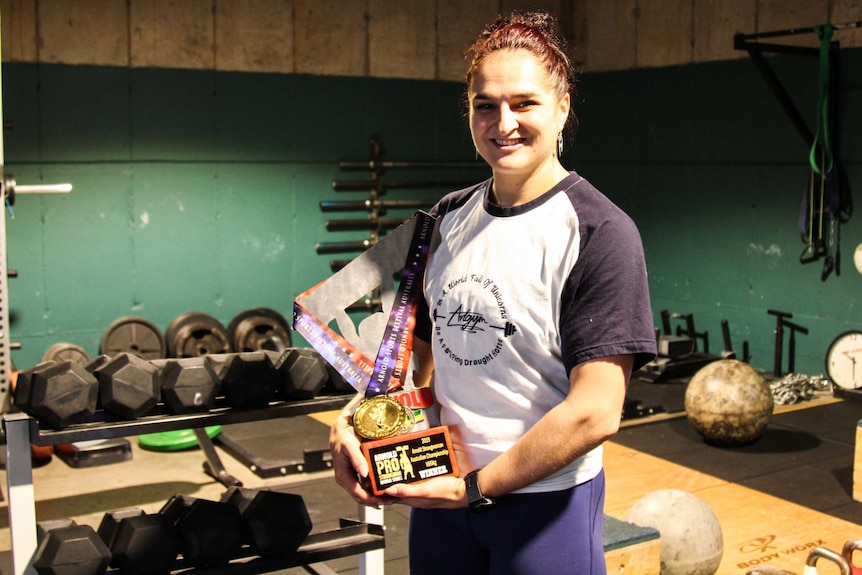 Camilla Fogagnolo with her strongwoman trophy