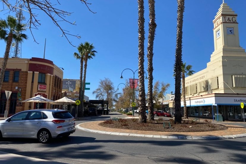 A car passes through the roundabout at Langtree Ave and Eighth Street in Mildura.