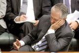 Opposition Leader Malcolm Turnbull leans on his hand, looking pensive