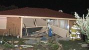 The back of a house in Thornlie after a car crashed into it