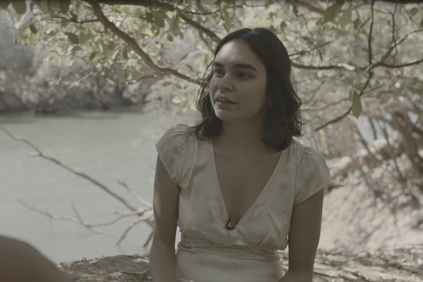 Young activist Marlikka Perdrisat sits by the Fitzroy River.