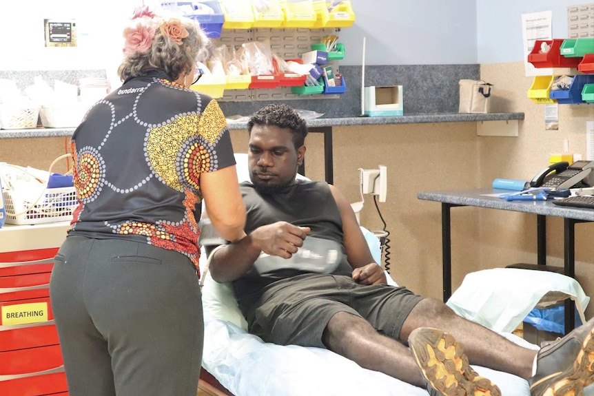A patient receives a blood pressure test at the Maningrida health clinic.