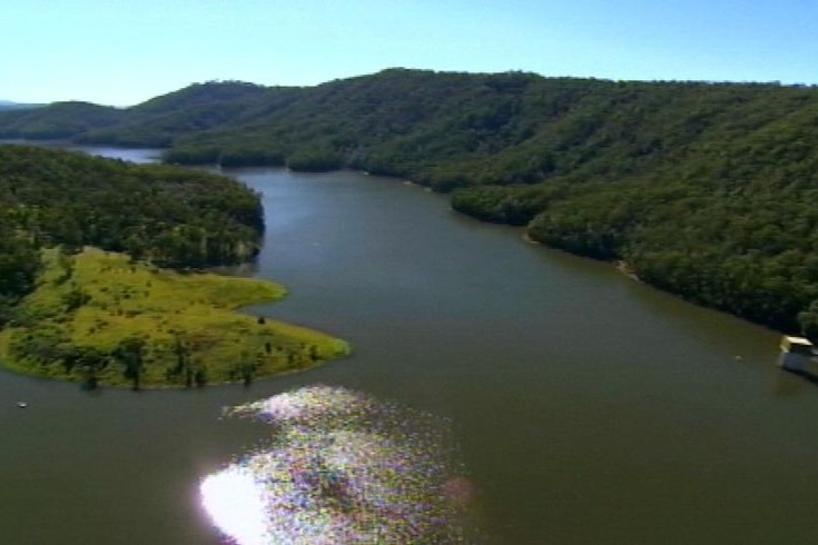 Aerial TV still of full Hinze Dam on Gold Coast hinterland in south-east Qld in October 2008.