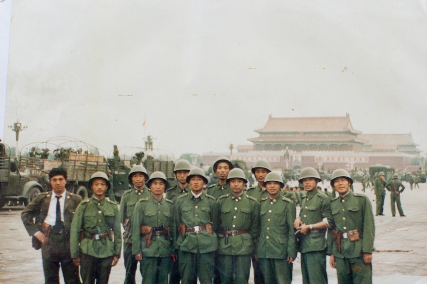 Xiaoming Li (fifth from the left) with his fellow soldiers in Tiananmen Square on June 5, 1989, the day after the massacre.