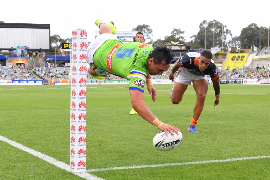 Jordan Rapana dives in against the Tigers