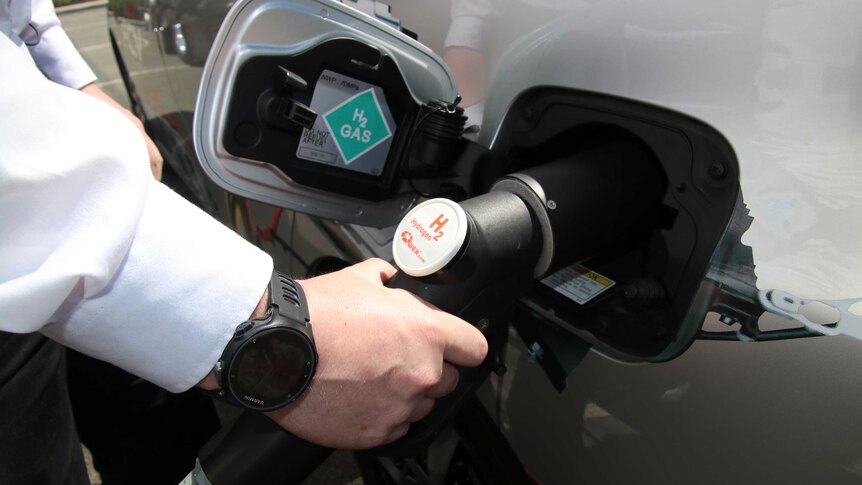 Close-up of the fuel tank of a hydrogen car as it is refuelled.