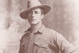 Portrait of man in military uniform with hat tilted at rakish angle