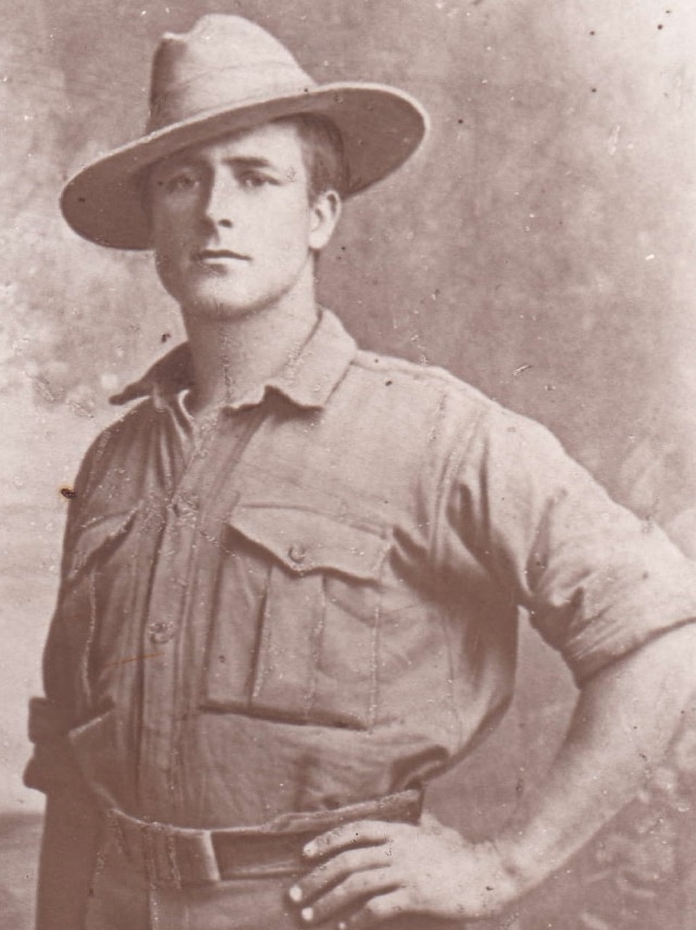 Portrait of man in military uniform with hat tilted at rakish angle