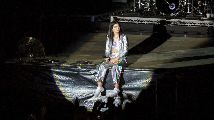 Lorde sitting front of stage at the Amphitheatre during her Friday night headline slot at Splendour In The Grass 2018