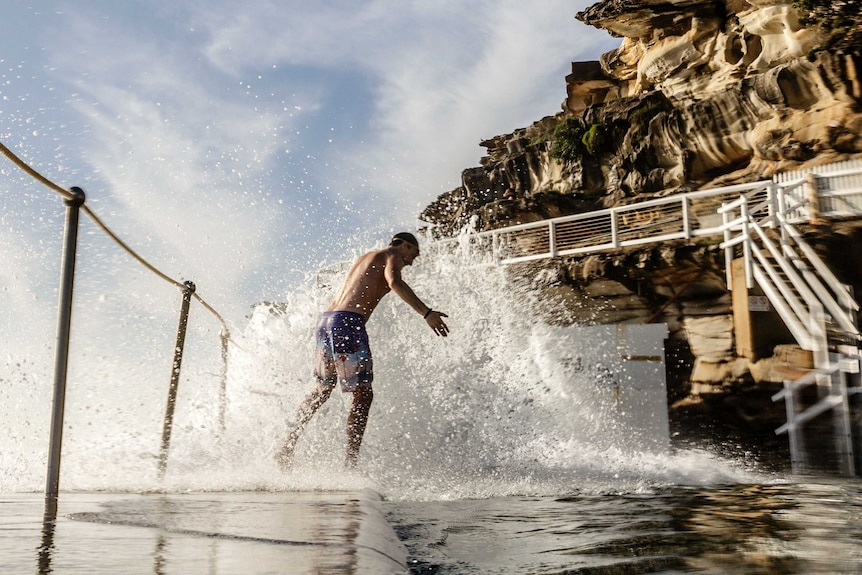 A beach-goer enjoys the waves at a Bronte Beach pool