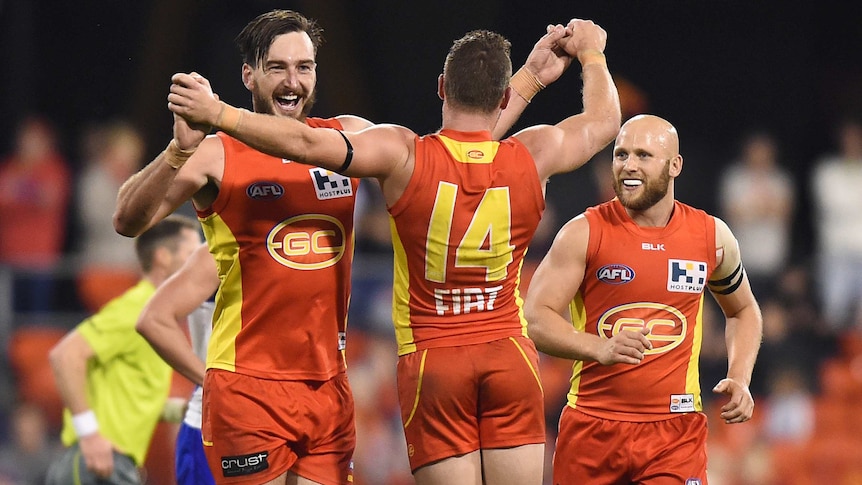 Gold Coast's Charlie Dixon reacts after kicking a goal against North Melbourne in July 2015.