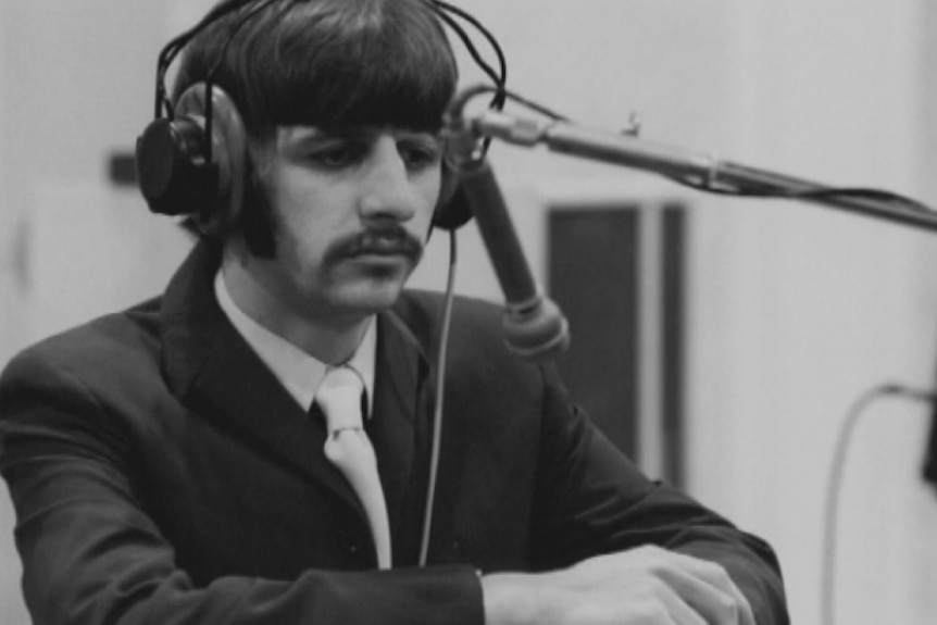 Ringo Starr at a microphone during the recording of the Sgt Pepper's album (1967)