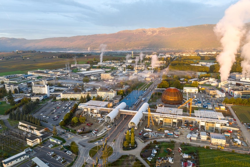 A drone picture showing the immense size of the CERN complex, with mountain ranges beyond