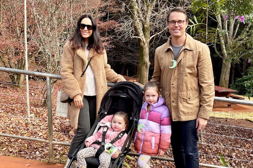 Sally and Mitchell Woodbry with their two children Lucia, 2,  and Valentina, 4, together in a street