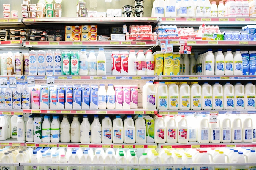 A supermarket fridge full of milk